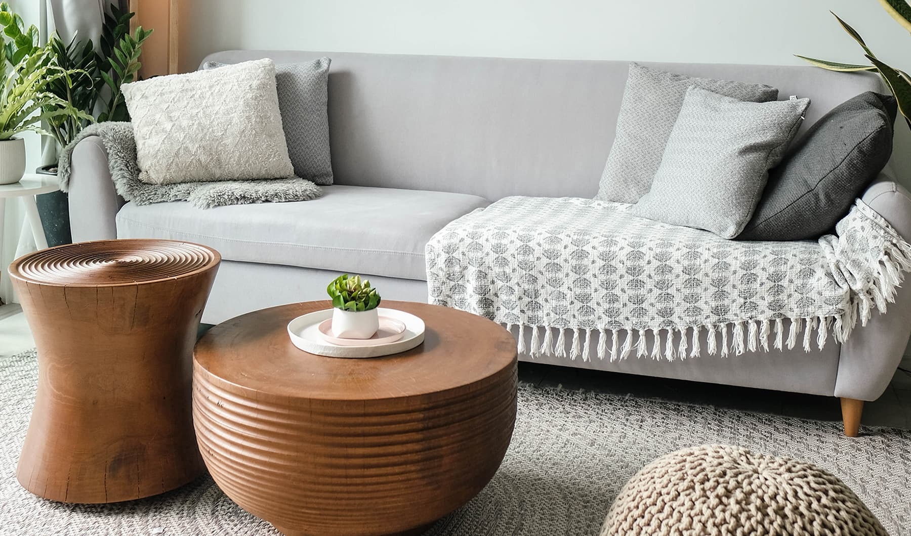 Living Begins Here lifestyle image of a living room with modern decoi